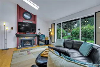 Gas fireplace & large picture window to enjoy the fruit trees and garden space.