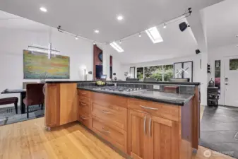 Large cooking island with breakfast bar.