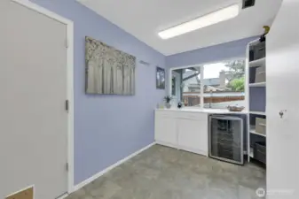 Laundry also includes a wine cooler.