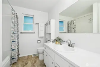 Fresh and airy full bath with neutral finishes.
