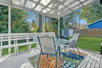 Relax or entertain under the covered back deck overlooking a private yard!