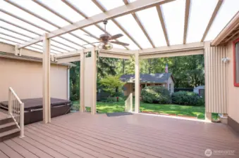 Relax on the spacious Trex deck with hot tub, taking in views of the backyard and the distant studio/flex space. It feels like your own private country retreat.
