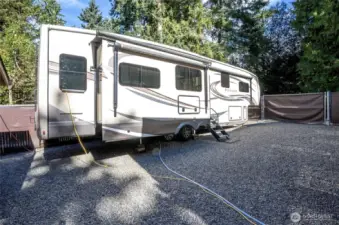 Secure gated RV and toy parking right beside the detached garage!