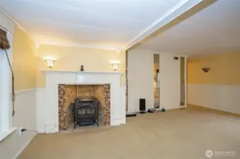 Living area with a pellet stove seamlessly integrated into the fireplace.