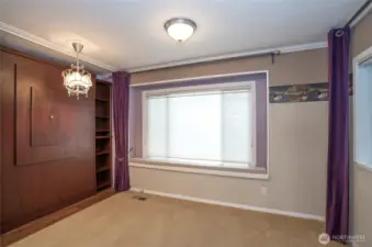 Charming guest suite with elegant wood closet and extra built-in storage!