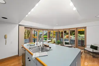 Kitchen with vaulted ceilings and large island is great for prepping food and entertaining guests.