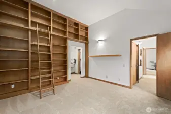 Second bedroom has bookshelves and a walk-in closet.