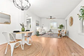 Updated lighting in this spacious living room & dining area