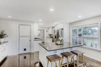 Kitchen island with door to basement utility room