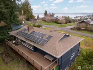 The Hardiplank siding was placed just a few years ago, as were the vinyl windows and solar on the composition roof. There is an expansive deck that is the full width of the home on the back off the dining room and garage.