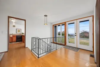 The entry is welcoming and opens to the kitchen, dining and living areas.