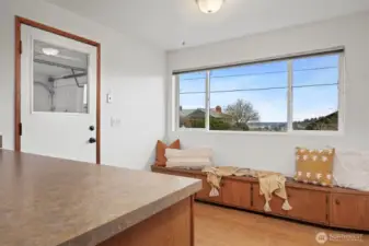 The informal eating area opens to the single car garage.