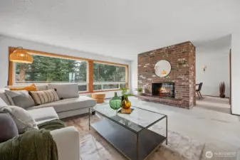 The living room has large widows that bring in the southern sunlight and take in the filtered views.