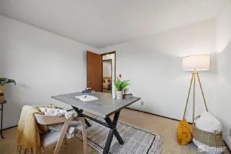 Looking across the 2nd bedroom toward the primary suite.