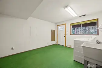 The laundry room has an abundance of room and this room could be redone into another livable space.