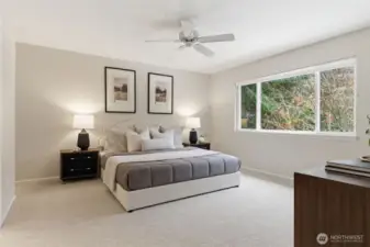 Spacious primary suite with backyard view