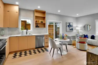 Kitchen features full height cabinets for extra storage, induction cooktop