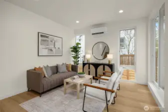 Kitchen opens to living and dining areas.