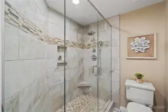 The primary bathroom also includes this large remodeled shower with a spa-like feel.