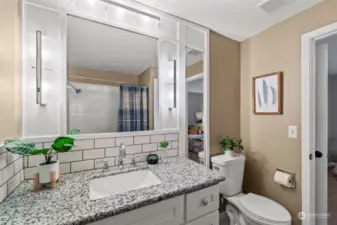 A refreshed jack-n-jill bath lies between two of the upstairs bedrooms