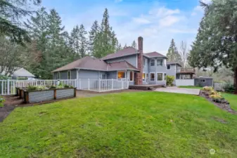 The back yard is amazing with a dog run, raised beds for growing plants/flowers, a large patio off of the trex deck, and so much more. A wedding was recently held in this yard.