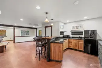 What a place to enjoy guests or to keep as a private retreat! A mini-kitchen with sink, microwave and refrigerator is such a perk to this space!