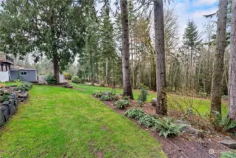 There is a terraced pathway down to the expansive sloping back yard making it easy for mowing purposes.