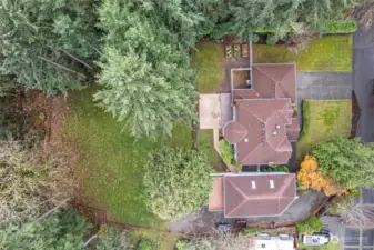 A drone view gives orientation of the detached shop next to the 2700+ sq. ft. home.