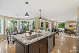 A no-edge sink allows for easy cleanup too! The nook and extra seating at the island are great for entertaining and enjoying guests. There is also a family room just off the kitchen.