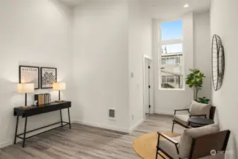 A sitting area on the main level. ADA bath to the left hand corner.