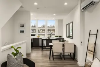 Livingroom flows into the open concept kitchen. Complete with minisplits and LVP flooring.