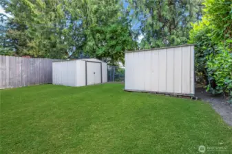 Back yard w/2 metal sheds