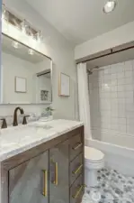 The marble tile floor complements the marble countertop...