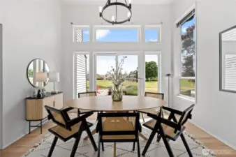An entertainer’s dream—this Formal Dining Room offers grandeur with vaulted ceilings and a backdrop of the 4th fairway and Mount Rainier from the adjoining patio.