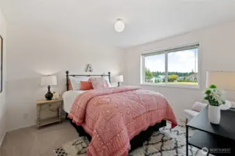 Bedroom #1 provides elevated sightlines to the fairway and Mount Rainier, plus a partial view of Lake Tapps to complete the scene.