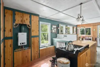 Kitchen with instant hot water heater. to the left.