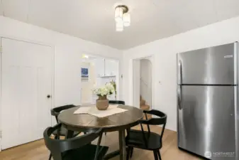 This area fits a larger table and the door to the left is a large pantry/closet!