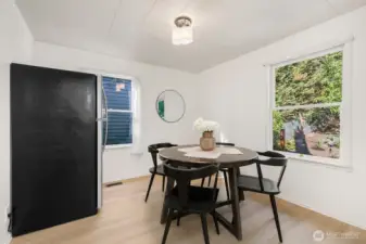 The window to the right overlooks the lush backyard and patio.