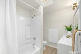 Full bathroom upstairs has been updated and is quite spacious. Plenty of storage in the new vanity, but also has built in wall cabinet. And a skylight!!