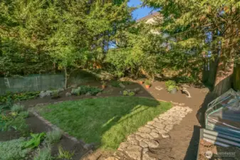The yard has new grass and mature landscaping - plus expansion potential!