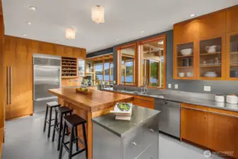 SubZero refrigeration, wine cooler, Miele dishwasher, Wolf range, and stunning custom cabinetry.