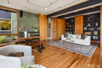 The room features distinctive architectural built-ins with display shelving.