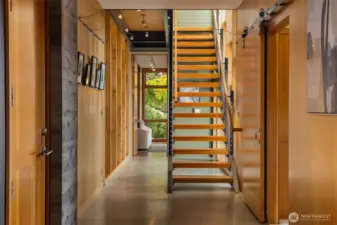 The home is equipped with an integrated art gallery hanging system and extensive low-voltage lighting including exquisite under rail stairway lighting.