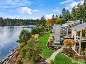 Meticulously curated landscape by Botanica’s John Vandenmerendonk includes  mature native plantings, fruit trees and raised beds.