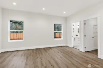 Owner's suite features a well appointed bath with custom shower & dual sink and Walk in Closet