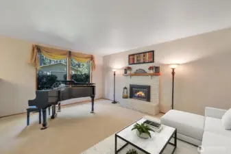 Formal living room with gas fireplace and beautiful view of the privacy the greenbelt offers