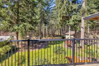 View from Primary bedroom deck. Overlooks peaceful and quiet greenbelt where birds and wildlife abound.