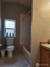 Full bath between bedrooms 2 & 3.