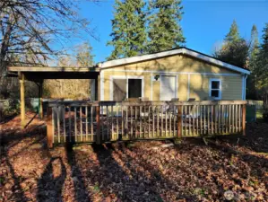 Deck and fenced yard off the utility room, plus covered patio out back.