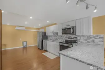 The complete kitchen in the daylight basement’s suite.